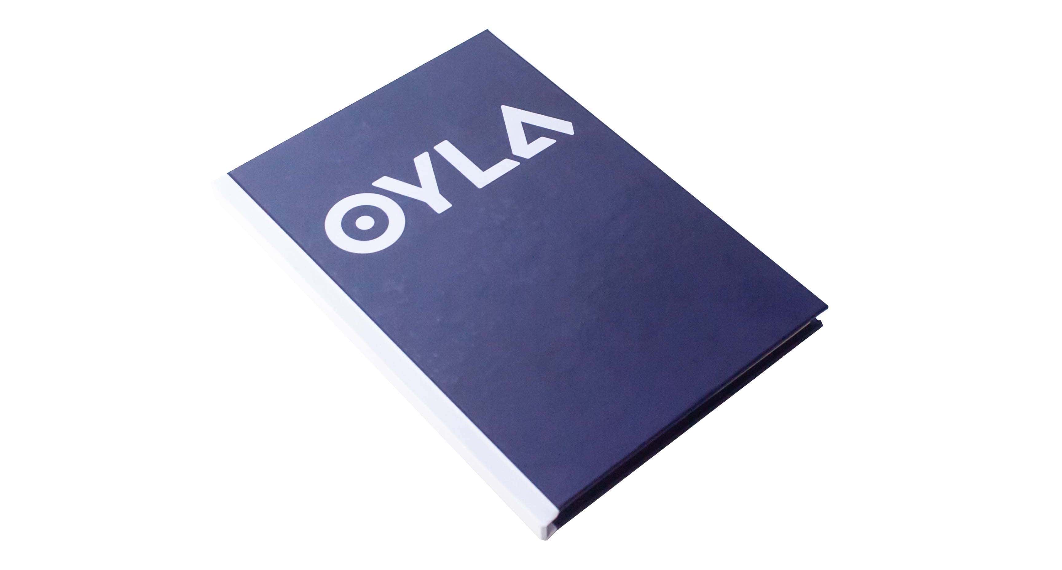 Hardcover book with the title "oyla" on the cover, isolated on a white background.
