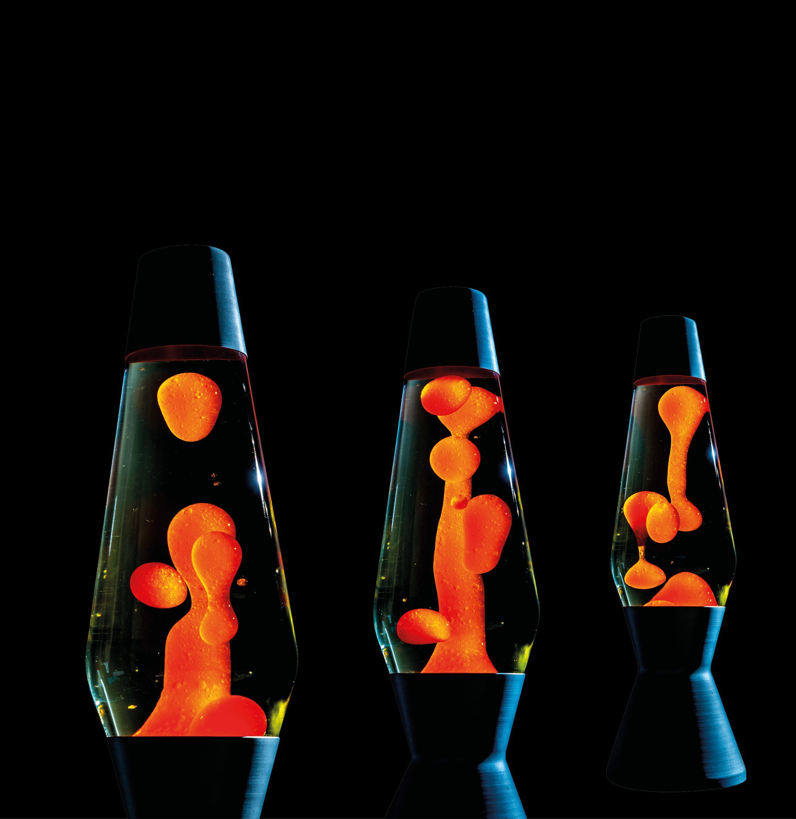 A collection of jars containing vibrant colored liquids resembling a lava lamp.