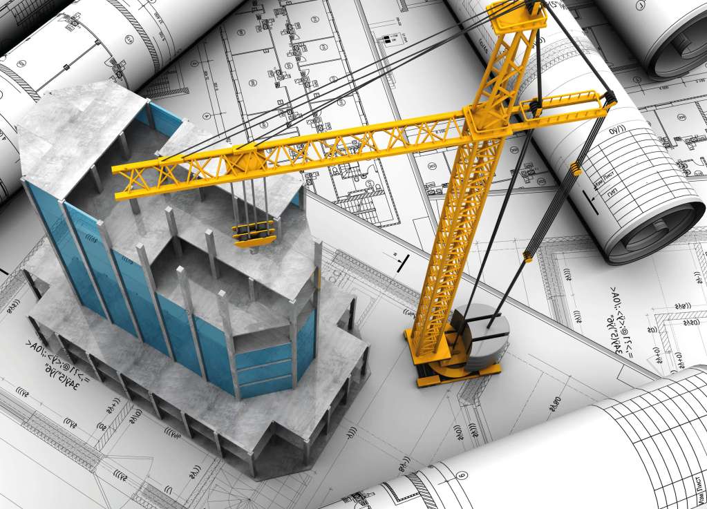 A crane and blueprints on top of a building.
